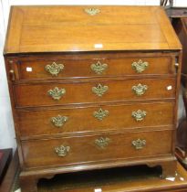 George III oak bureau, the fall front enclosing a fitted interior above graduated drawers and