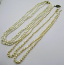 Two graduated cultured pearl necklaces (one at fault), together with a freshwater pearl necklace