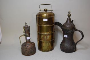Antique Middle Eastern copper coffee pot, together with a smaller jug and a four section tiffin box