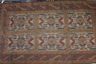 Soumak rug with a six panel design in shades of brown, deep red and orange, 197 x 116cm