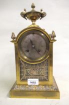 19th Century French gilt brass mantel clock with urn surmount, the two train movement striking on