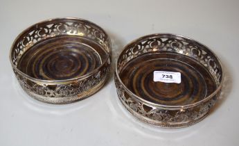 Pair of late 19th / early 20th Century plate on copper bottle coasters with turned wooden bases