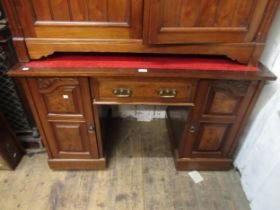 Victorian walnut twin pedestal writing desk, the red leather inset top above a central drawer