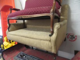 Early 20th Century upholstered two seat sofa on low shaped supports, 135cm wide x 86cm high x