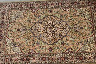 Indo Persian rug with a lobed medallion and all-over floral design on a pale green ground with