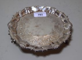 George II silver card salver with an engraved centre panel, shell pattern rim and three hoof