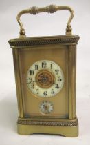 Small 19th Century French gilt brass carriage clock, the circular dial with Arabic numerals, with