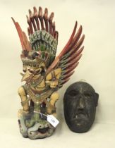 Balinese carved and wooden figure of a deity, 31cm high together with a carved wooden ceremonial