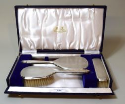 Birmingham silver four piece dressing table set in fitted box by Mappin and Webb