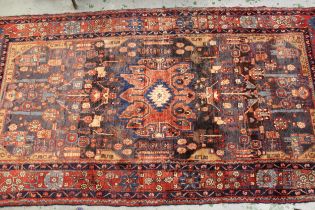 Hamadan rug with an all-over stylised flowerhead design on a blue / beige ground with rose ground