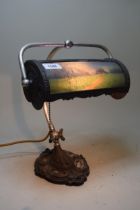 20th Century silvered adjustable desk lamp with shade, having hand painted landscape panel, signed