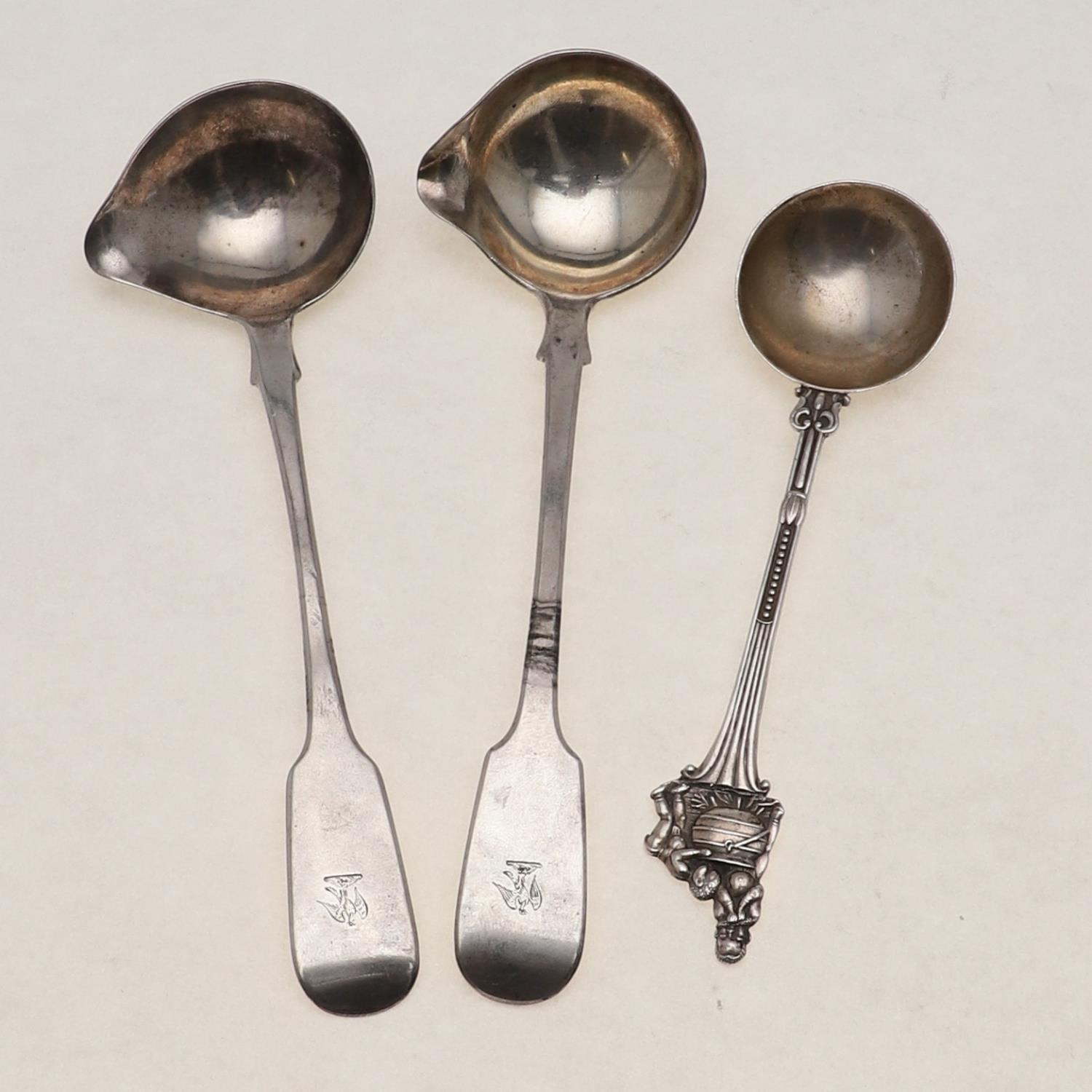 TWO SIMILAR EARLY VICTORIAN CREAM/SAUCE LADLES.