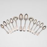 A SET OF SIX GEORGE III FIDDLE PATTERN IRISH DESSERT SPOONS.