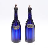 PAIR OF BLUE GLASS DECANTERS & WINE LABELS INCLUDING VICTORIAN SILVER BRANDY LABEL.
