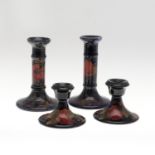 TWO PAIRS OF ANTIQUE MOORCROFT CANDLESTICKS - POMEGRANATE.