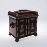 A REGENCY ROSEWOOD AND MOTHER-OF-PEARL TRAVELLING CABINET.
