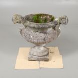 A STONE URN PLANTER.