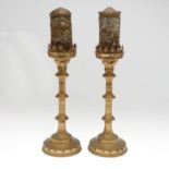 A PAIR OF RUSSIAN BRASS CANDLESTICKS.