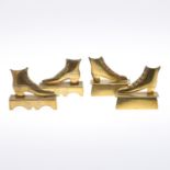 TWO PAIRS OF BRASS MANTEL SHOES.