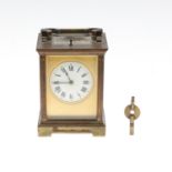 A BRASS REPEATING CARRIAGE CLOCK.