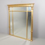 A LARGE GILT OVERMANTEL MIRROR.