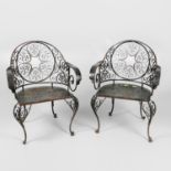 A SET OF EIGHT WROUGHT IRON GARDEN CHAIRS.