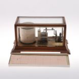 AN EARLY 20TH CENTURY OAK CASED BAROGRAPH.