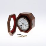 A BRASS CASED DRUM CLOCK.