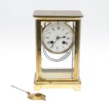 A FRENCH FOUR PANE MANTEL CLOCK.