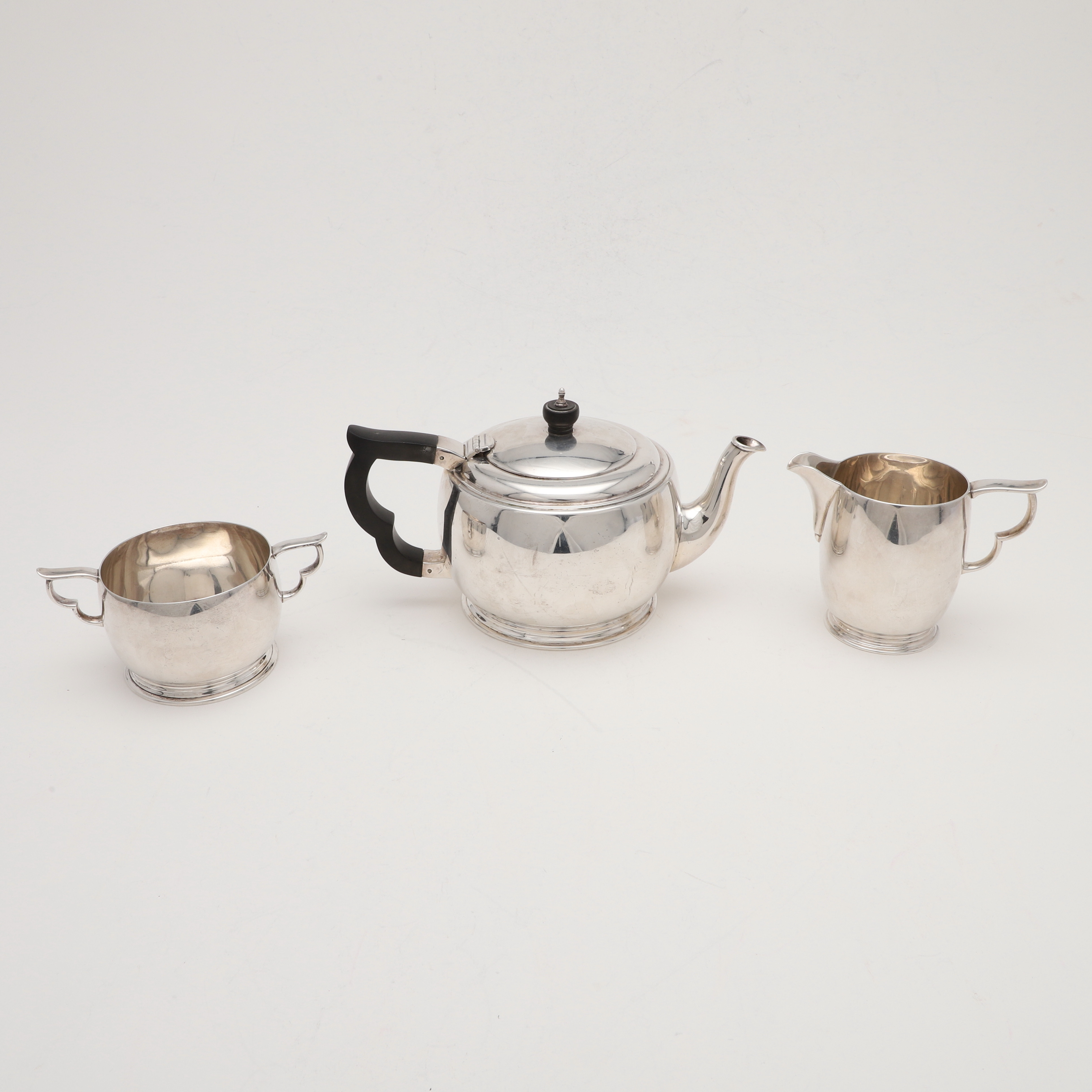 AN EARLY 20TH CENTURY THREE-PIECE TEASET.