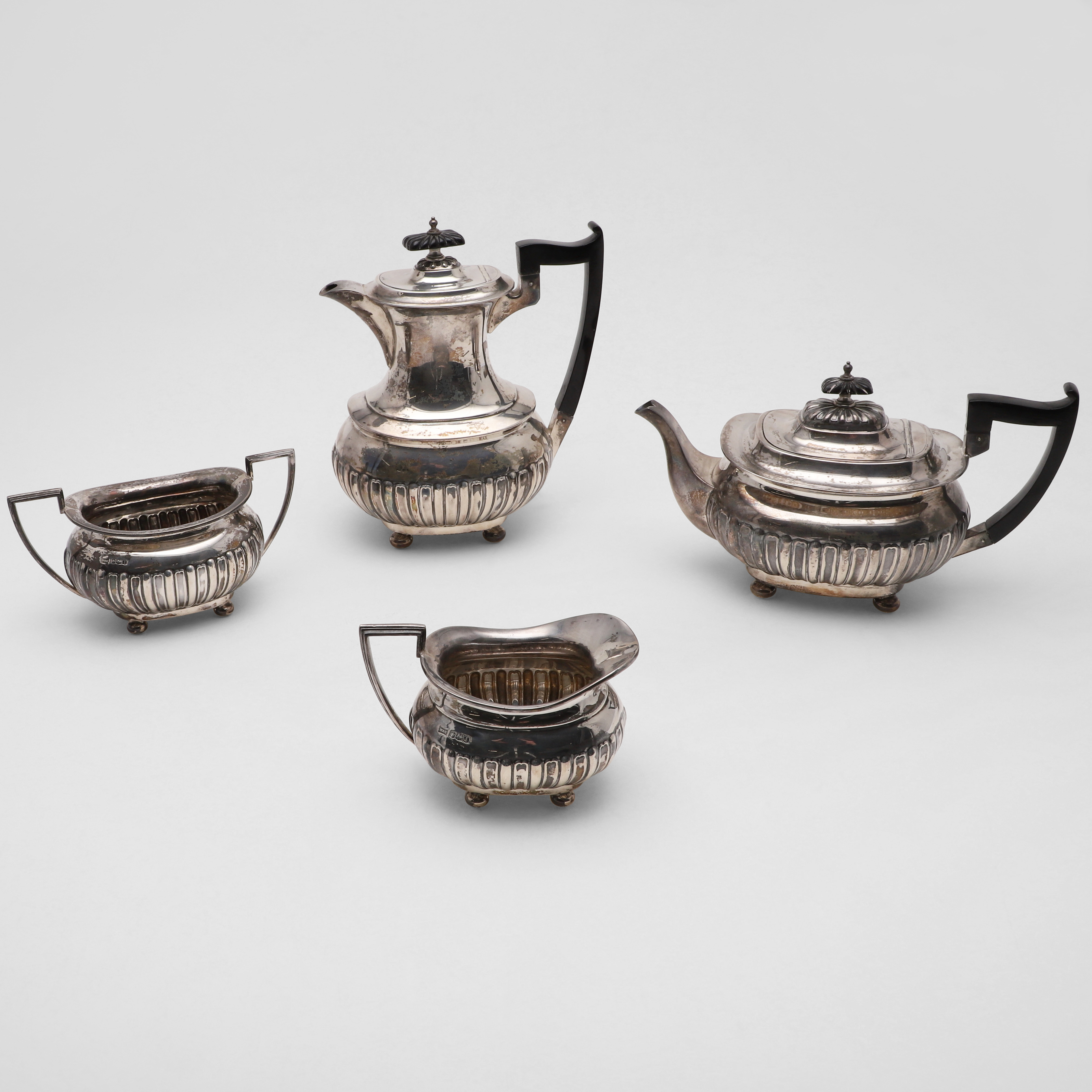 A GEORGE V FOUR-PIECE TEA SET.