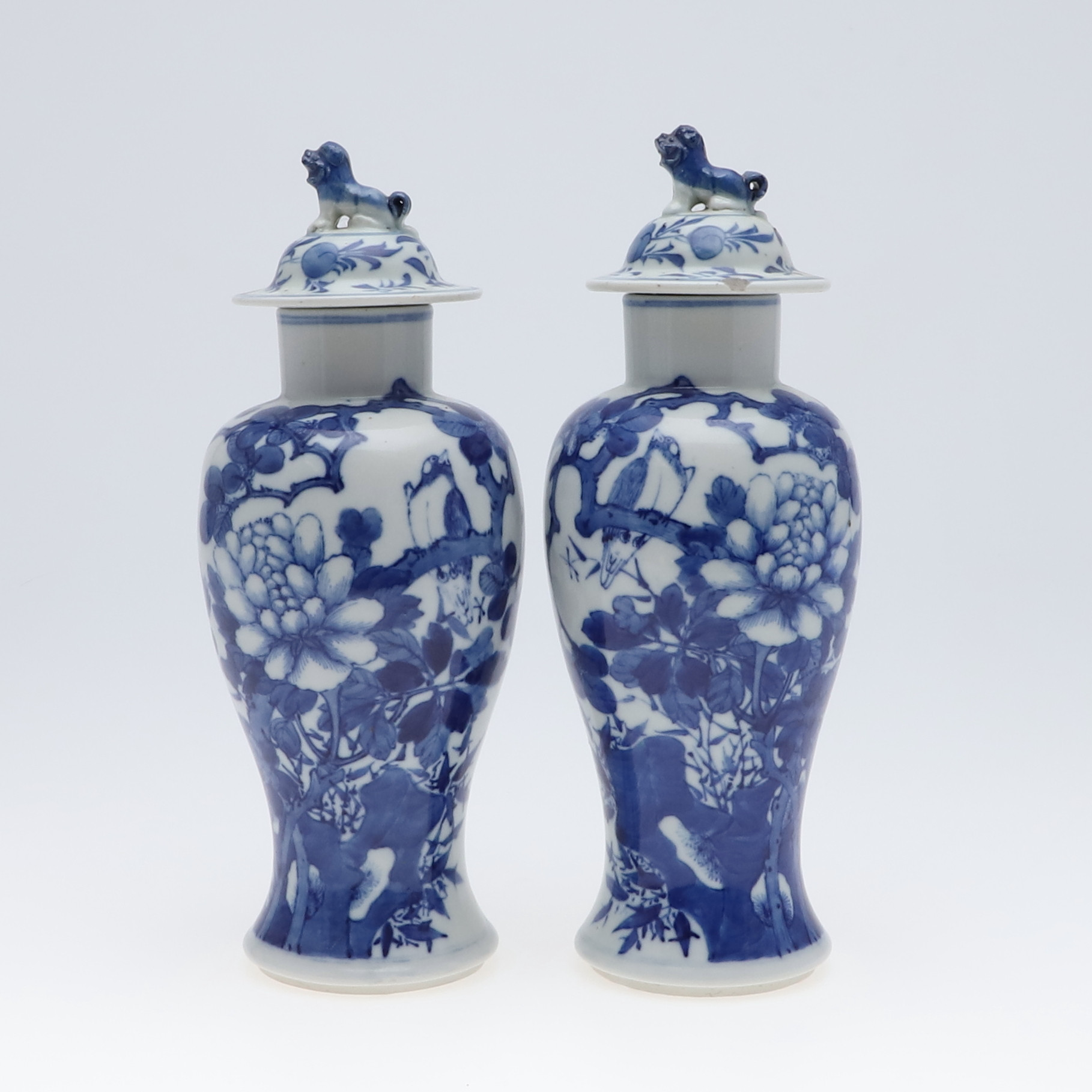 PAIR OF CHINESE BLUE & WHITE VASES & COVERS.
