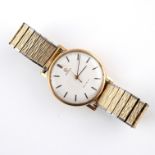 A GENTLEMAN'S GOLD WRISTWATCH BY OMEGA.