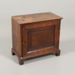 AN 18TH CENTURY OAK SPICE CUPBOARD.