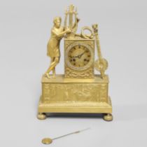A FRENCH EMPIRE STYLE GILT METAL MANTEL CLOCK.