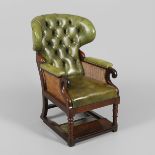A 19TH CENTURY RECLINING CHESTERFIELD LIBRARY ARMCHAIR.