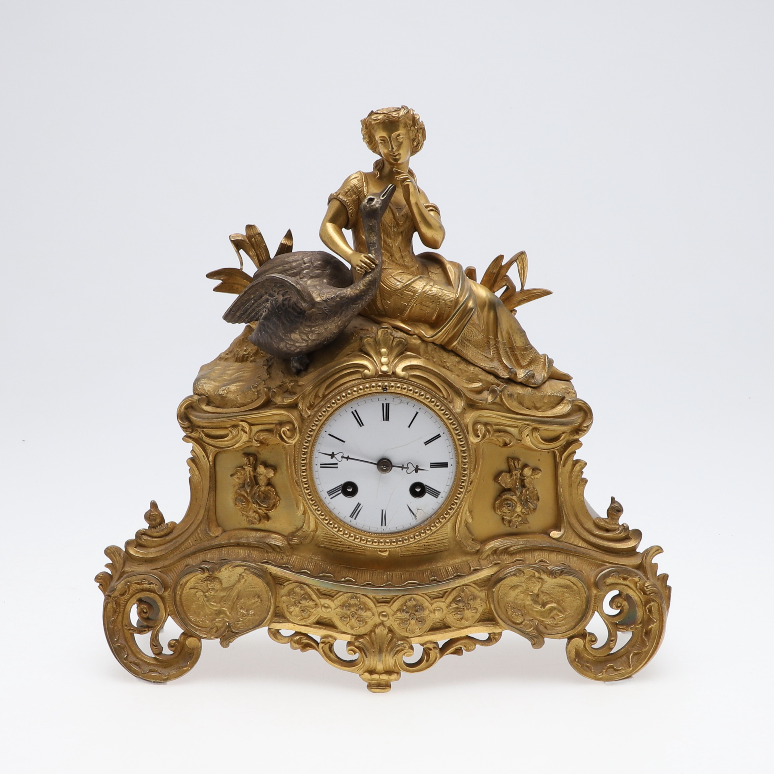 A FRENCH GILT METAL FIGURAL MANTEL CLOCK.