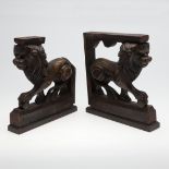A PAIR OF CARVED OAK MEDICI LIONS.