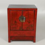 A 20TH CENTURY CHINESE RED LACQUERED CABINET.
