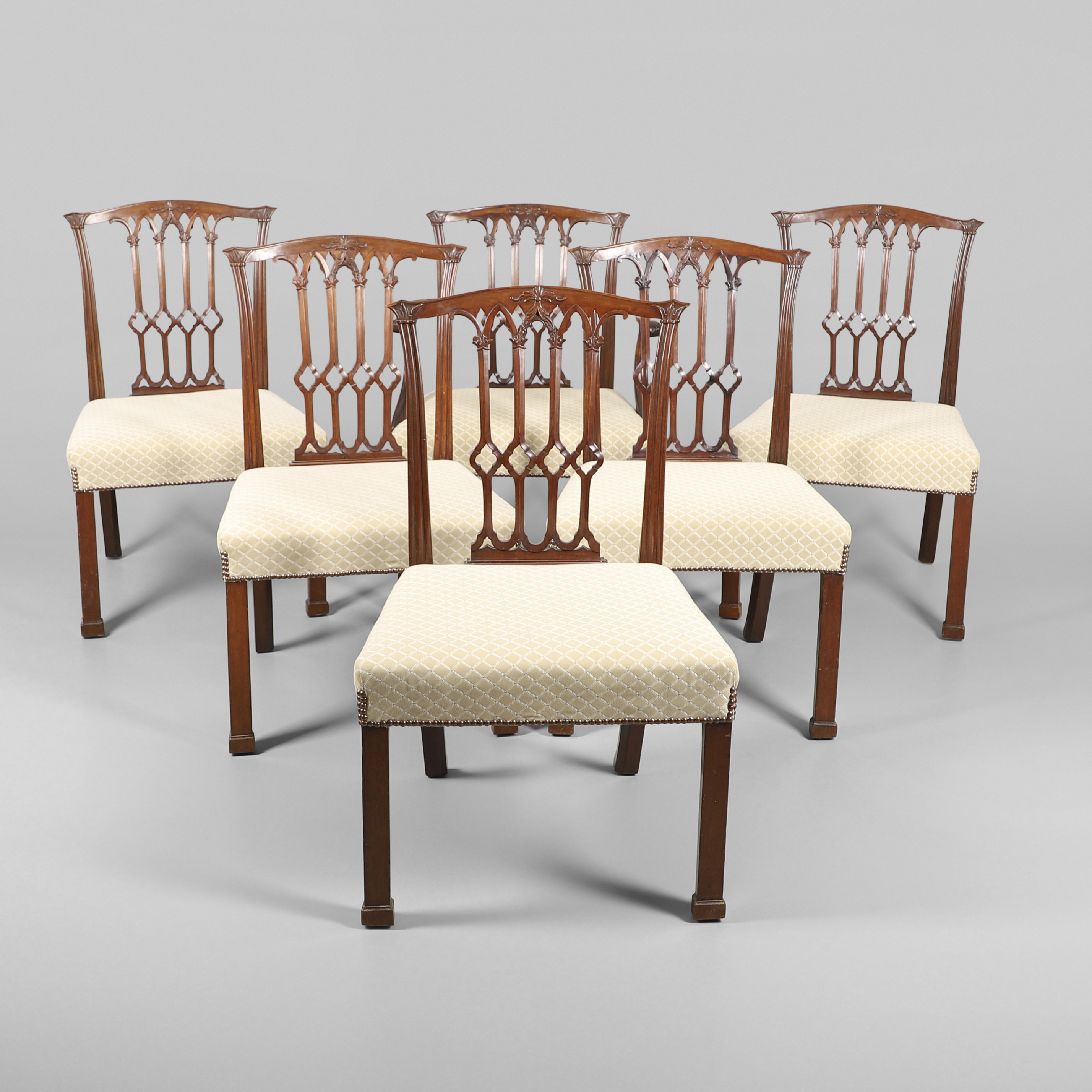 A SET OF SIX GEORGE III MAHOGANY DINING CHAIRS.