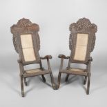 A PAIR OF BURMESE CARVED HARDWOOD PLANTATION ARMCHAIRS.