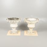 A PAIR OF PAINTED COMPOSITE MARBLE GARDEN URNS.