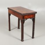 A CHINESE-CHIPPENDALE STYLE MAHOGANY CARD TABLE.