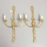 A PAIR OF REGENCY STYLE GILT METAL WALL LIGHTS.