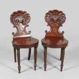 A PAIR OF 19TH CENTURY MAHOGANY HALL CHAIRS.