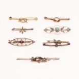 AN EDWARDIAN 15CT GOLD, SAPPHIRE AND HALF PEARL BROOCH AND SIX FURTHER BAR BROOCHES.
