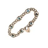 A 9CT GOLD AND TURQUOISE CURB LINK BRACELET.