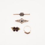 THREE GARNET SET BROOCHES AND A GARNET RING.