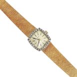 A LADY'S 18CT GOLD AND DIAMOND WRISTWATCH BY LONGINES.