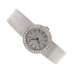 A LADY'S 18CT WHITE GOLD AND DIAMOND WRISTWATCH BY CERTINA.